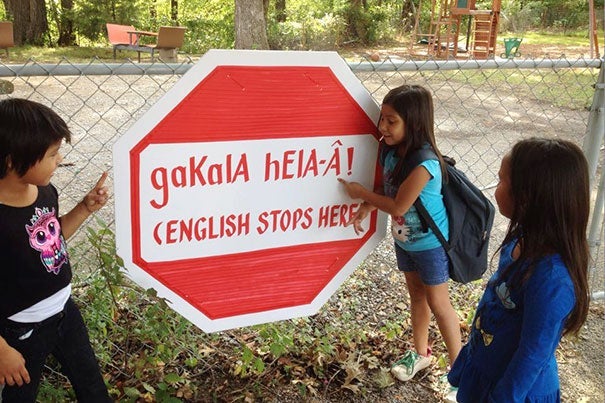 Students reading a sign in Yuchi