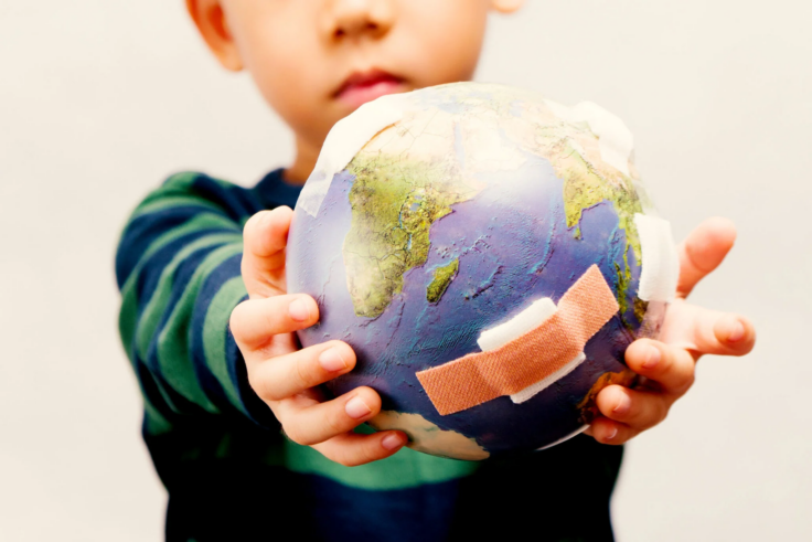 A child holding a globe